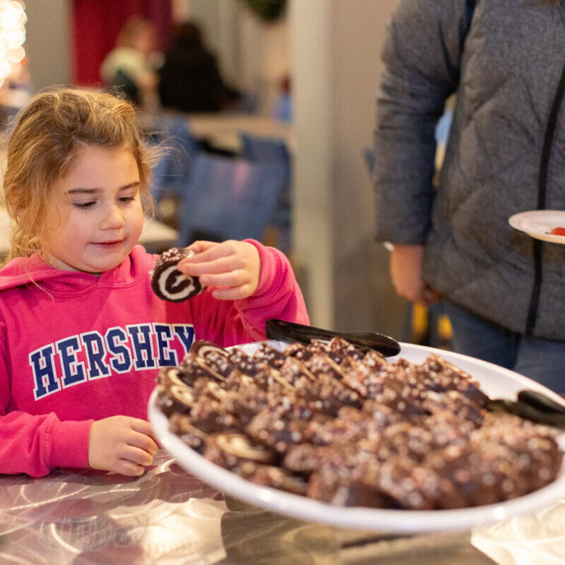 Child eating Christmas cookies